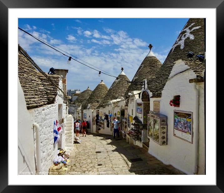 Shopping in Alberobello Framed Mounted Print by Sheila Ramsey