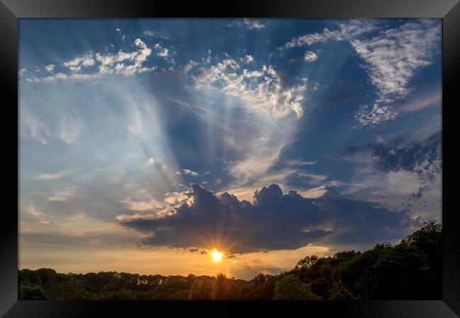 Sun rays and clouds Framed Print by Leighton Collins