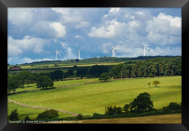 Wind Turbines on the Skyline of a Rural Landscape. Framed Print by Steve Gill