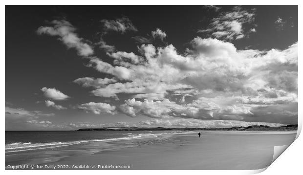 A lone beach walker under a dramatic sky Print by Joe Dailly