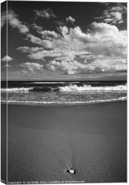 Lone pebble on a monochrome beach Canvas Print by Joe Dailly