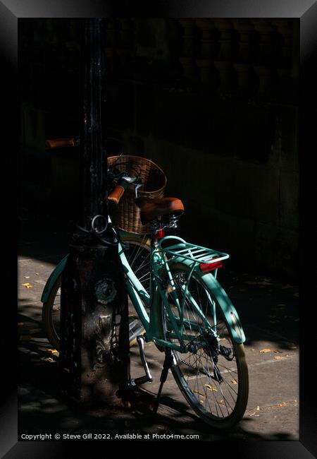 Vintage Style Turquoise Ladies Bicycle Locked to a an urban Lamp Post. Framed Print by Steve Gill