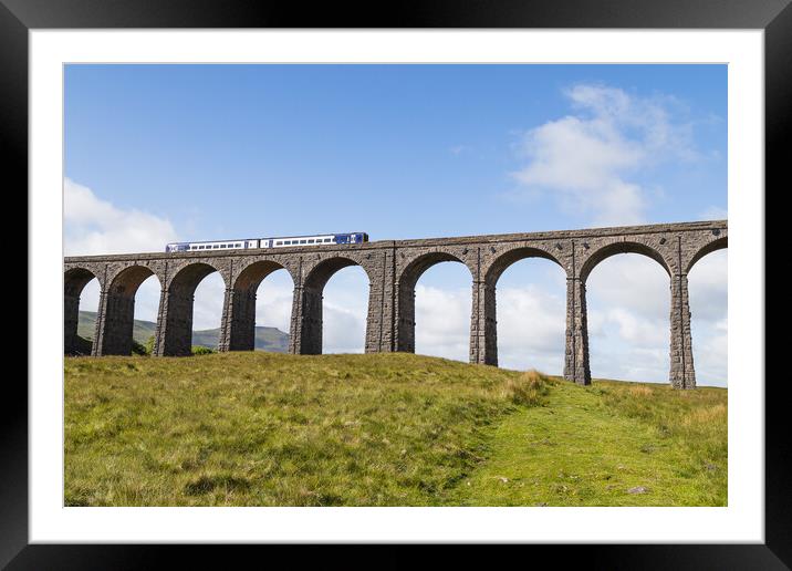 Train passing over the Ribblehead Viaduct  Framed Mounted Print by Jason Wells