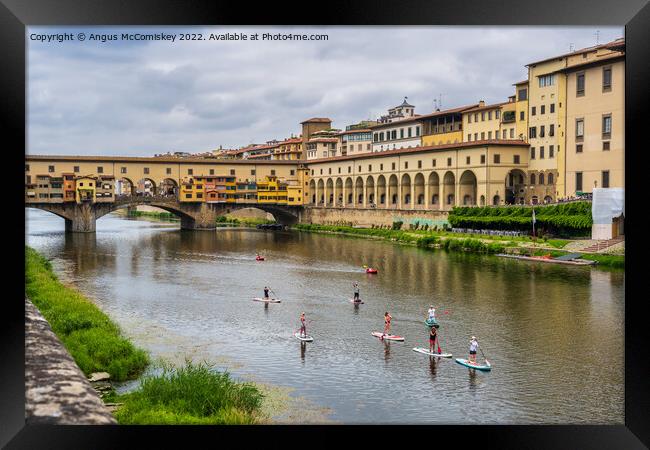 Paddle boarders on the Arno in Florence, Tuscany Framed Print by Angus McComiskey