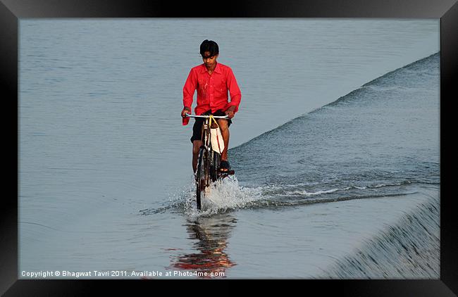 Cyclist in RED Framed Print by Bhagwat Tavri