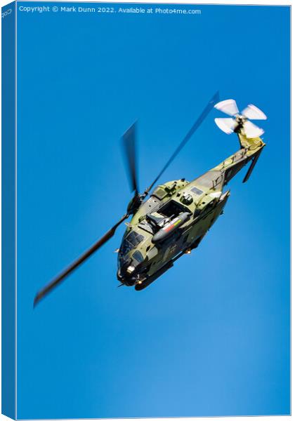 Military Helicopter in flight with nose down Canvas Print by Mark Dunn