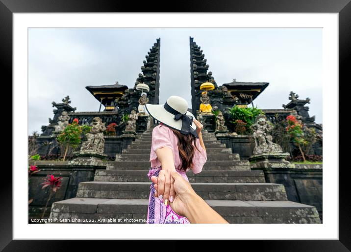 Women tourists holding man's hand  Framed Mounted Print by Stan Lihai