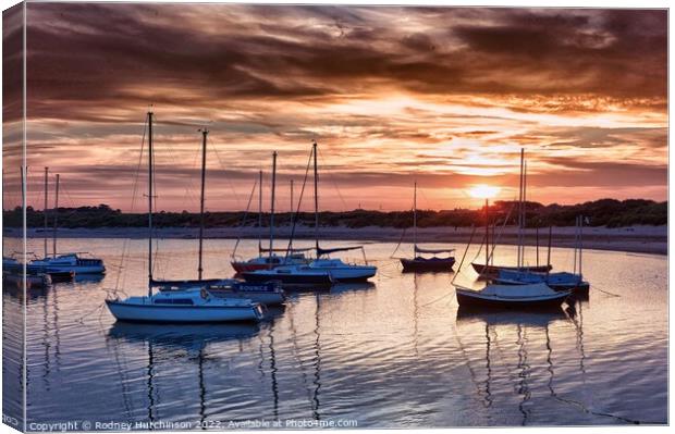 Serene Sunset over Beadnell Bay Canvas Print by Rodney Hutchinson