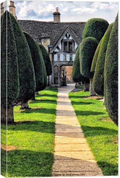 Painswick Village Church and Yew Trees Canvas Print by Julie Gresty