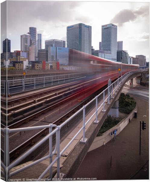 DLR arriving in front of Canary Wharf Canvas Print by Stephen Coughlan