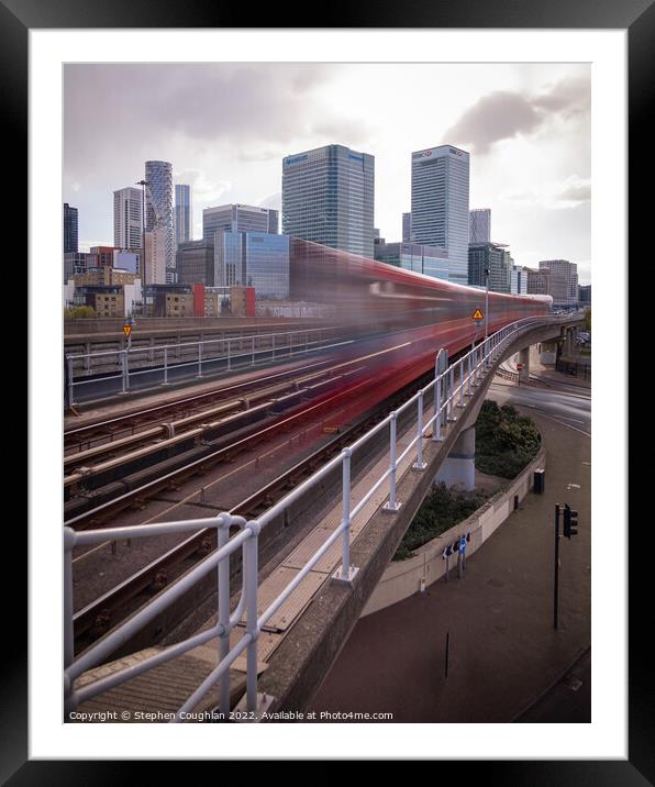 DLR arriving in front of Canary Wharf Framed Mounted Print by Stephen Coughlan