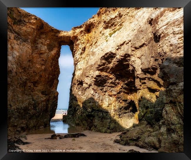 Perranporth Beach Rock Arch Cornwall. Framed Print by Craig Yates