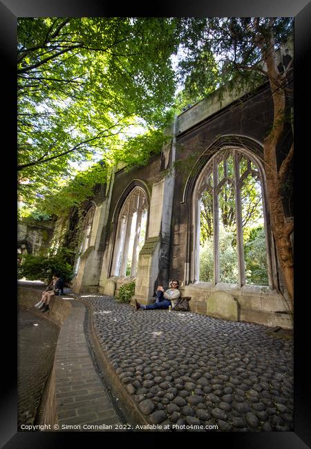 Relaxing in St Dunstans Framed Print by Simon Connellan