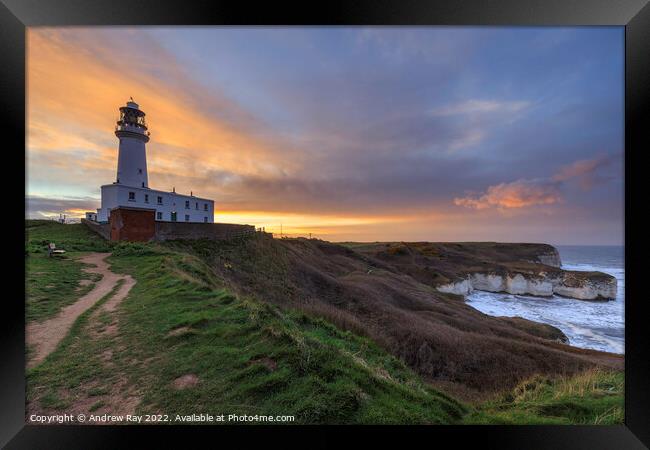 Setting sun behind Flamborough Lighthouse Framed Print by Andrew Ray