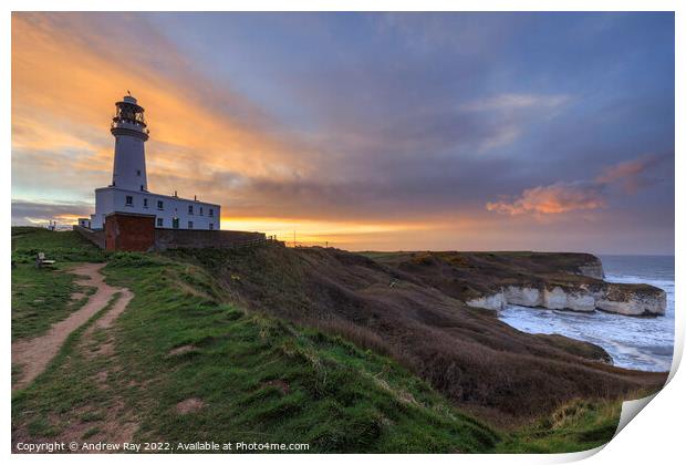 Setting sun behind Flamborough Lighthouse Print by Andrew Ray
