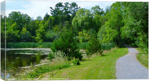 Serene Path Alongside Jackson Park Pond Canvas Print by Ken Oliver