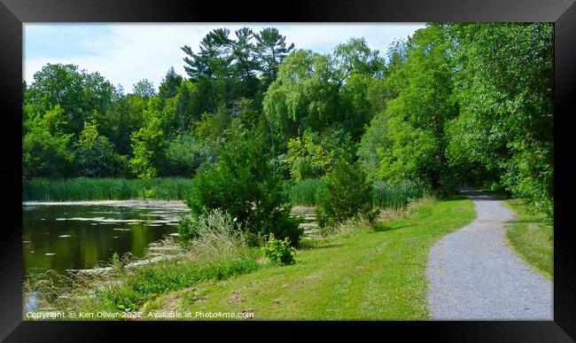 Serene Path Alongside Jackson Park Pond Framed Print by Ken Oliver