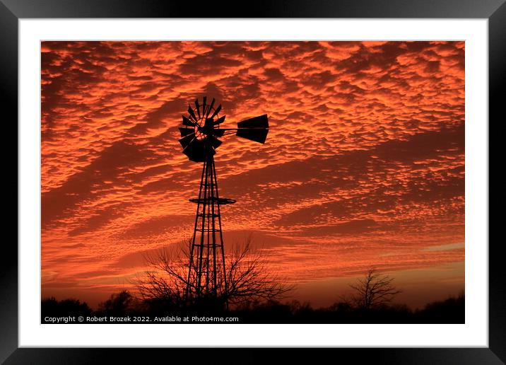 Kansas Sunset with a colorful sky and Windmill  Framed Mounted Print by Robert Brozek