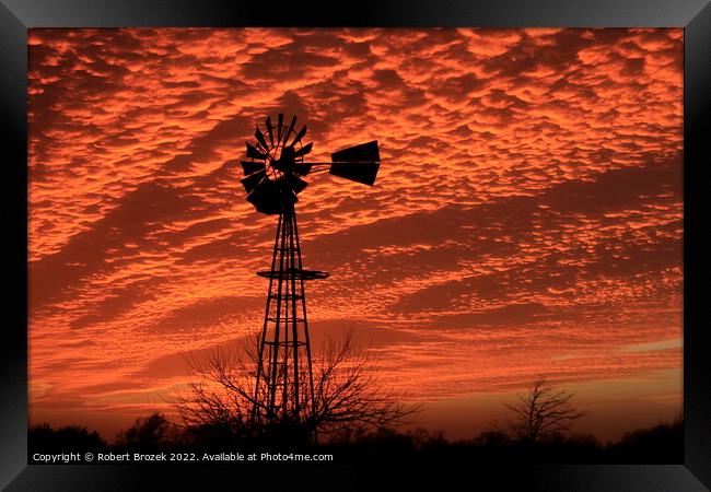 Kansas Sunset with a colorful sky and Windmill  Framed Print by Robert Brozek