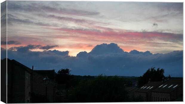 Sunset clouds Canvas Print by Roy Hinchliffe