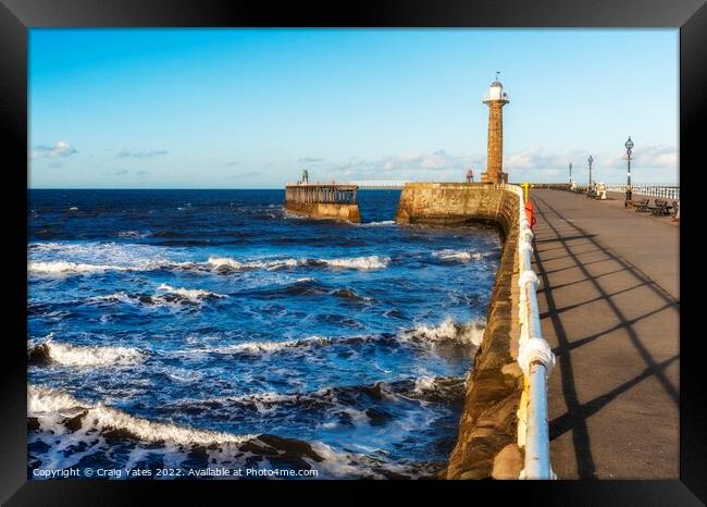 Whitby Lighthouse and Pier Yorkshire. Framed Print by Craig Yates