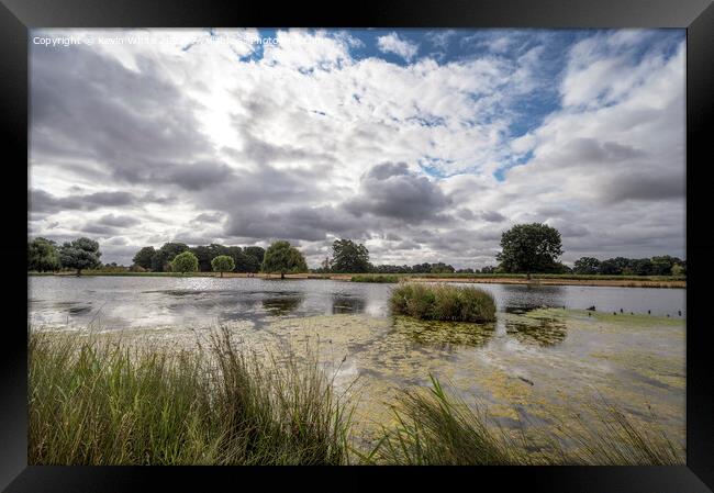 Morning clouds over Heron pond Bushy Park Framed Print by Kevin White