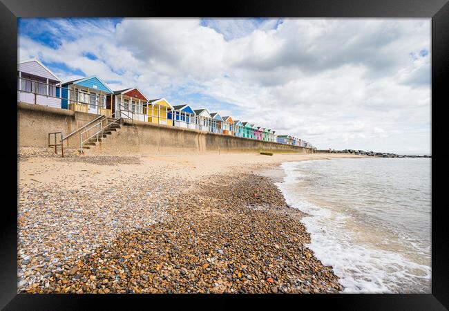 Southwold beach huts next to the pier Framed Print by Jason Wells