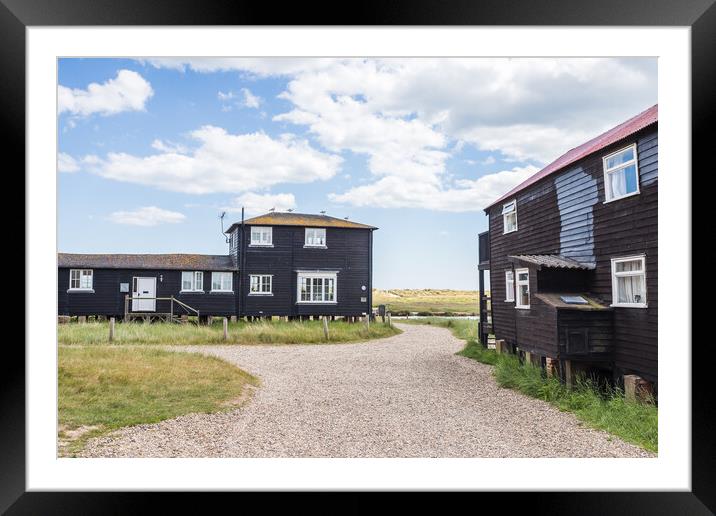 Black fishing huts Framed Mounted Print by Jason Wells