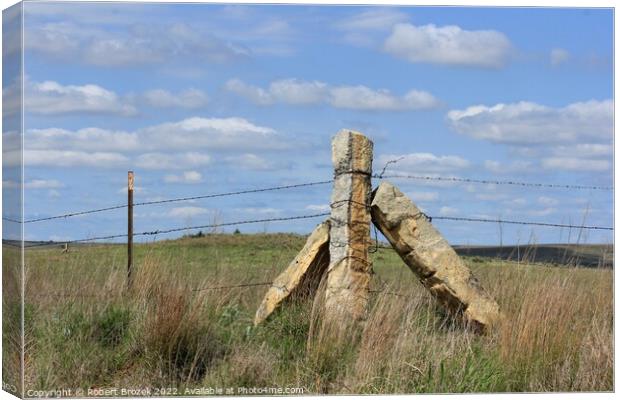 Stone Post corner fence with a field and blue sky Canvas Print by Robert Brozek