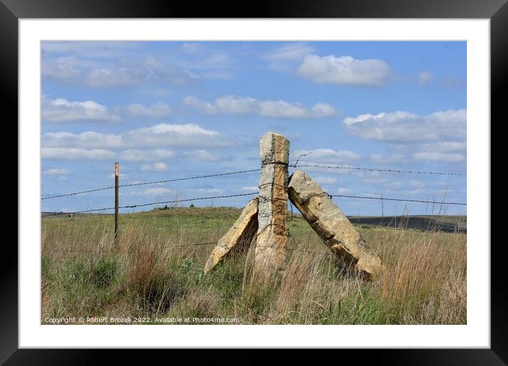 Stone Post corner fence with a field and blue sky Framed Mounted Print by Robert Brozek