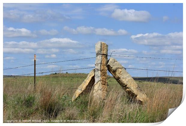 Stone Post corner fence with a field and blue sky Print by Robert Brozek