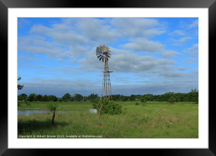 Windmill with grass and sky Framed Mounted Print by Robert Brozek