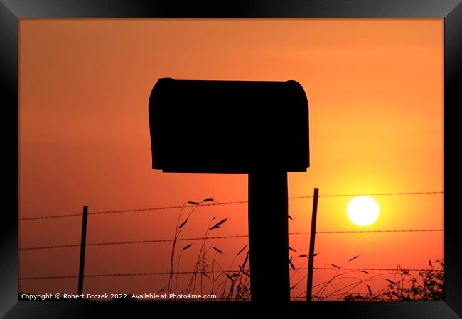 Mailbox silhouette at sunset with orange sky Framed Print by Robert Brozek