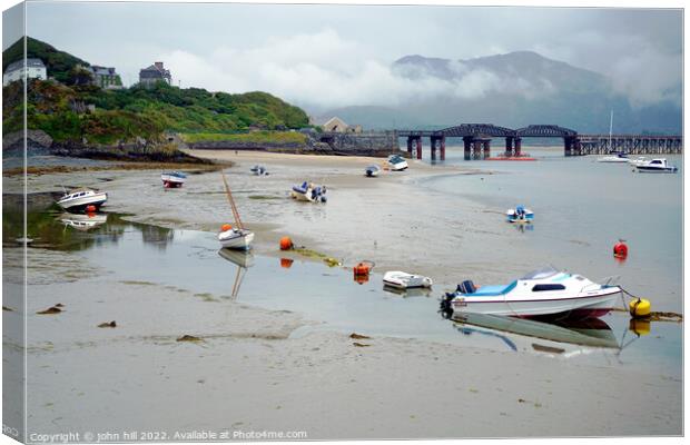 Reflections at low tide in Barmouth, Wales. Canvas Print by john hill