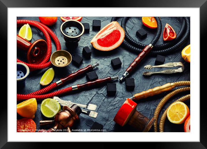 Smoking hookah with citrus fruits. Framed Mounted Print by Mykola Lunov Mykola