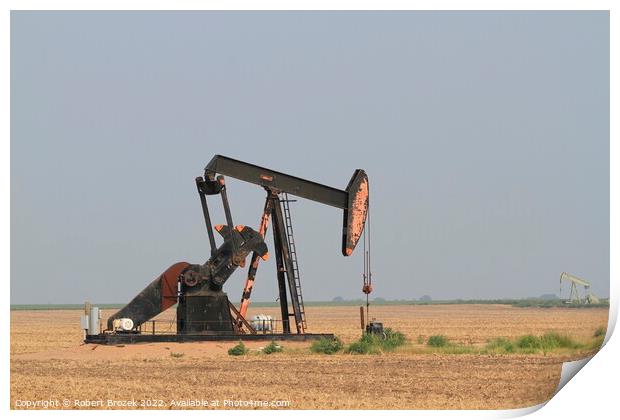 Outdoor field with oilwell pump and blue sky Print by Robert Brozek