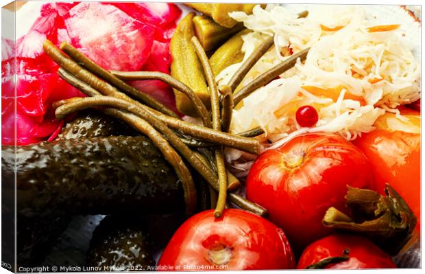 Pickled vegetables and sauerkraut, close up Canvas Print by Mykola Lunov Mykola