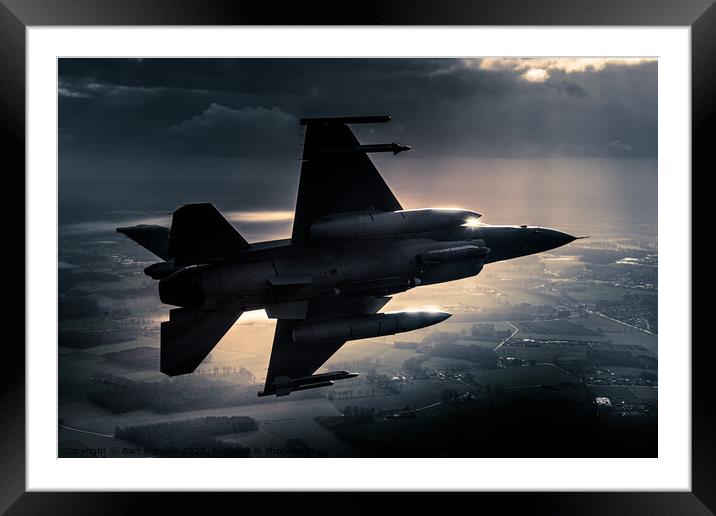 A fighter jet F-16 breaking away in a special light Framed Mounted Print by Bart Rosselle