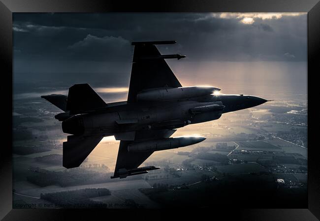 A fighter jet F-16 breaking away in a special light Framed Print by Bart Rosselle