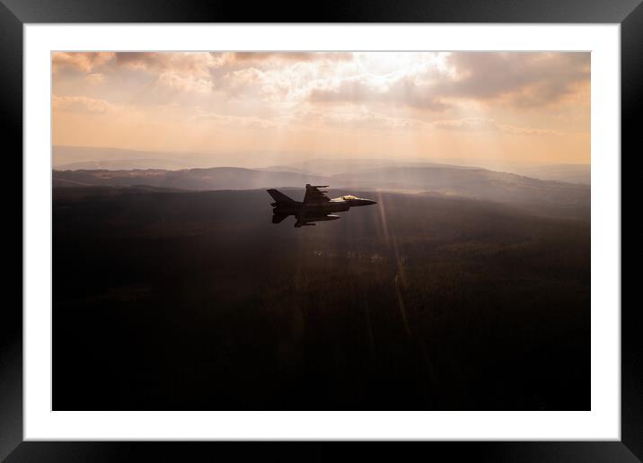 A fighter jet F-16 breaking away in a special light Framed Mounted Print by Bart Rosselle