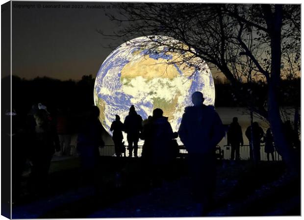 People silhouetted on an Earth artwork on Penningt Canvas Print by Leonard Hall