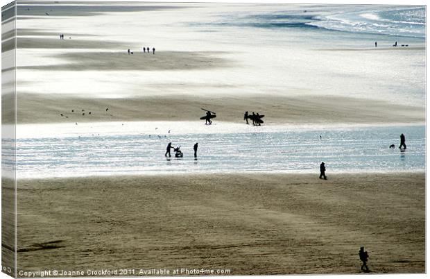 Silhouettes on the sand Canvas Print by Joanne Crockford