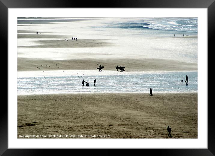 Silhouettes on the sand Framed Mounted Print by Joanne Crockford