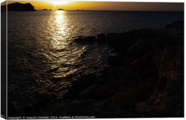 A warm sunset with the sun reflecting on the surface of the sea, Canvas Print by Joaquin Corbalan