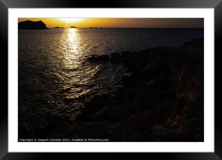 A warm sunset with the sun reflecting on the surface of the sea, Framed Mounted Print by Joaquin Corbalan