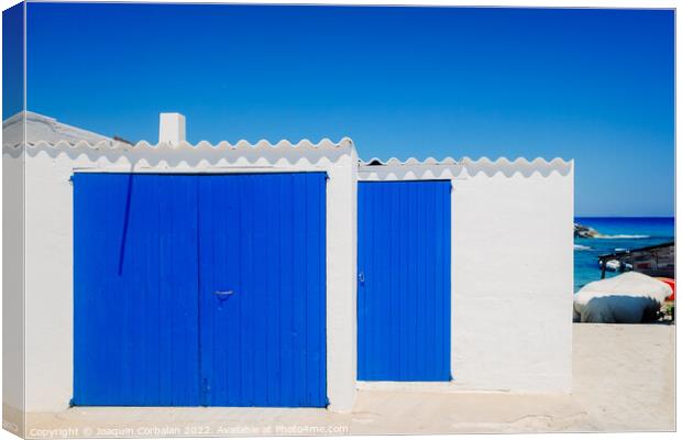 Fisherman's hut with white walls and colorful blue wooden doors  Canvas Print by Joaquin Corbalan