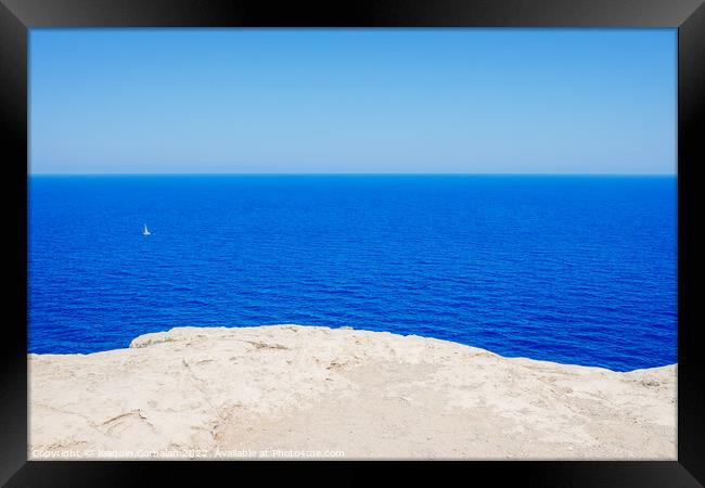 Intense blue sea, relaxing background of the coast seen from abo Framed Print by Joaquin Corbalan