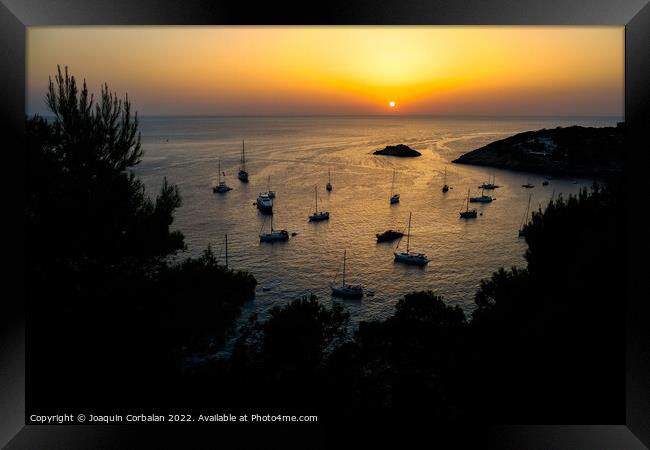  Several pleasure boats anchored in a cove on the island of Ibiz Framed Print by Joaquin Corbalan