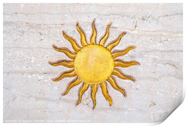 The drawing of a sun with golden rays engraved on marble on a wa Print by Joaquin Corbalan