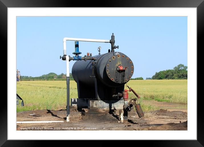 Oil Well Storage Equipment in a field Framed Mounted Print by Robert Brozek